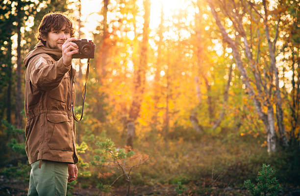 istock Young Man with retro photo camera outdoor Lifestyle 516546253