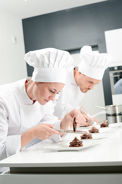 istock pastry cook professional team in restaurant kitchen preparing chocolate dessert 516546492