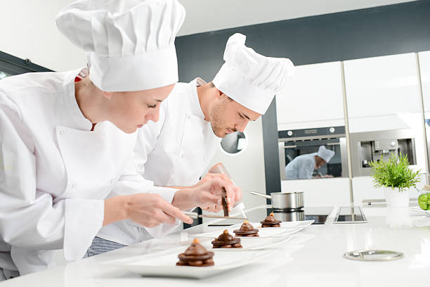 istock pastry cook professional team in restaurant kitchen preparing chocolate dessert 516546838