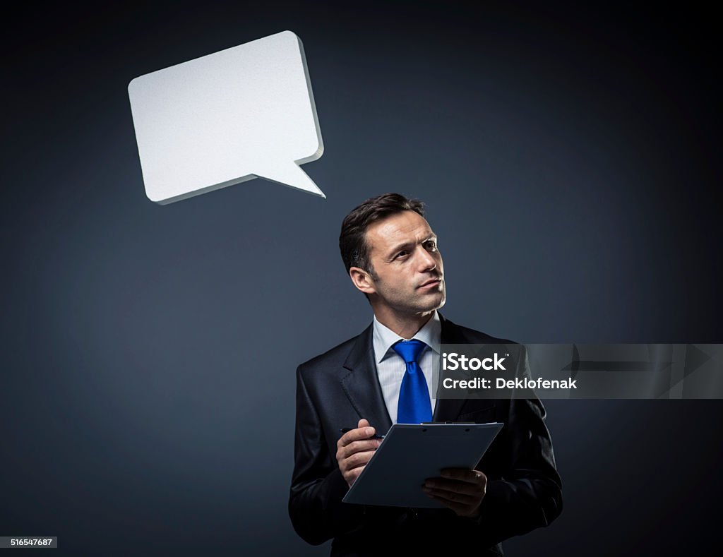 Working Business man in a suit with clipboard 40-49 Years Stock Photo
