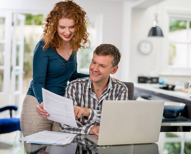 istock Couple paying the bills online 516548155