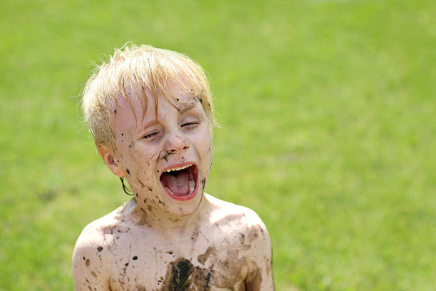istock Crazy Little Muddy Child Playing Outside 516548173