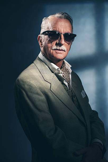 istock Retro 1940 senior businessman wearing sunglasses. Studio shot. 516549770