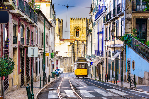Lisbon, Porgugal cityscape and tram near Lisbon Cathedral.