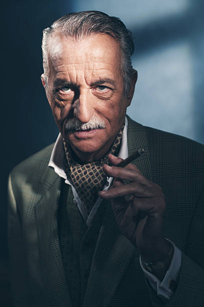 istock Cigar smoking retro 1940 senior businessman. Studio shot. 516550112