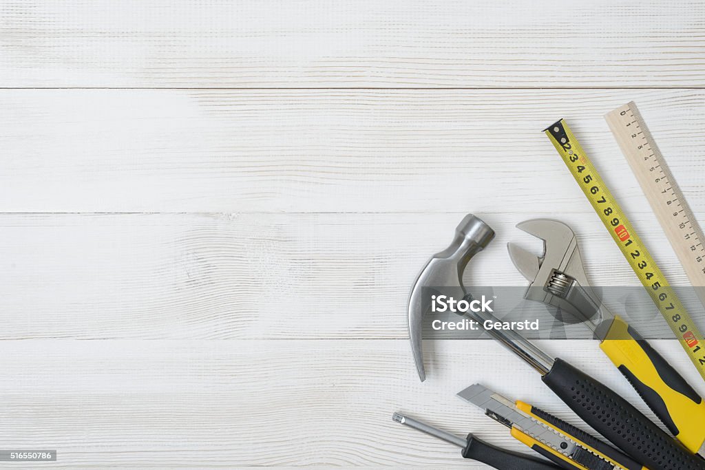 Top view of construction instruments and tools on wooden DIY Top view of construction instruments and tools on wooden DIY workbench. Backgrounds Stock Photo