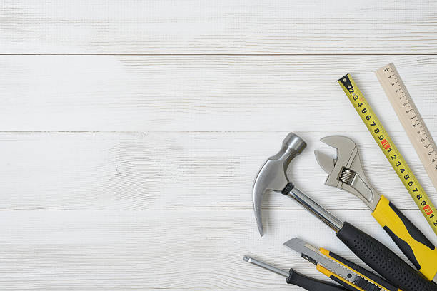 Top view of construction instruments and tools on wooden DIY stock photo