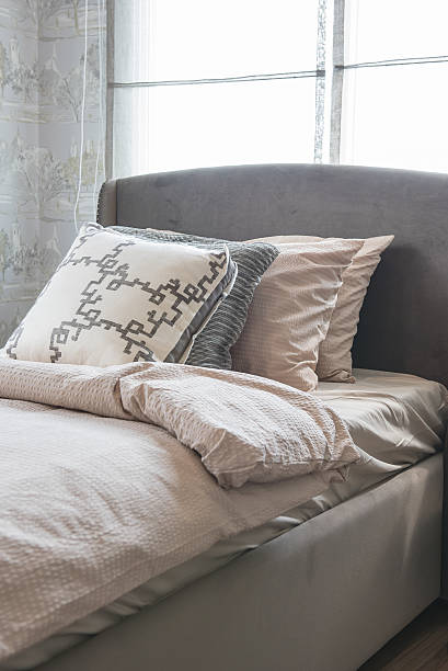 istock single bed with row of pillows 516551224