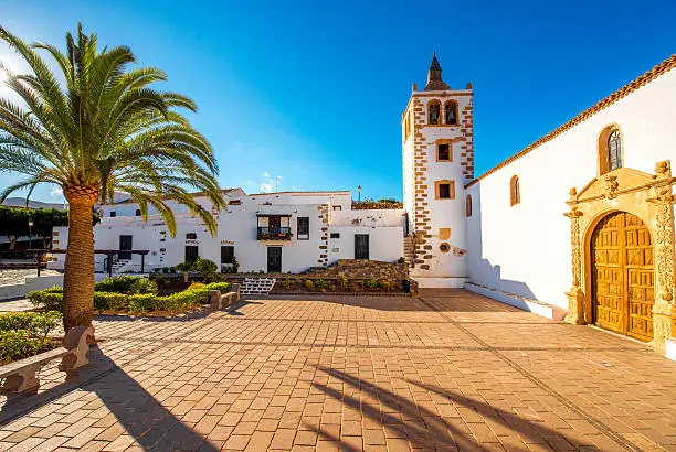 Central square with church tower in Betancuria village on Fuerteventura island in Spain