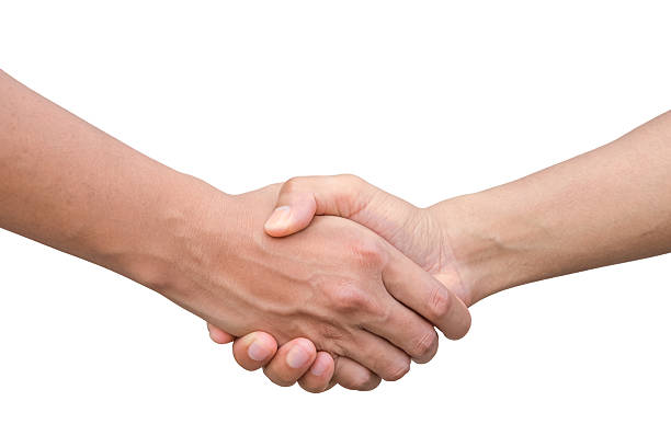 two businessmen shaking hands to celebrate a successful agreement stock photo