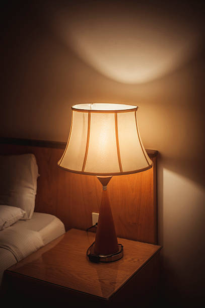istock Turned On Old Lamp near the wall 516551907