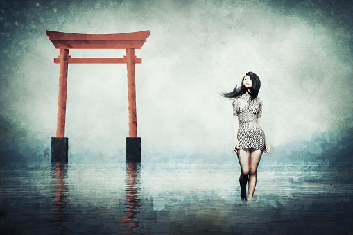 Sad Japanese woman in derelict shrine.
