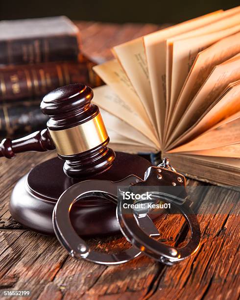 Wooden Gavel And Books On Wooden Table Stock Photo - Download Image Now - Handcuffs, Justice - Concept, Auction