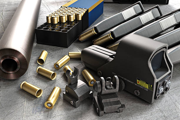 Assault rifle accessories collection Assault rifle accessories collection consisting of bullet rounds, gun barrel , magazines , front and rear sites , and a laser guided rifle scope.  personal accessory stock pictures, royalty-free photos & images