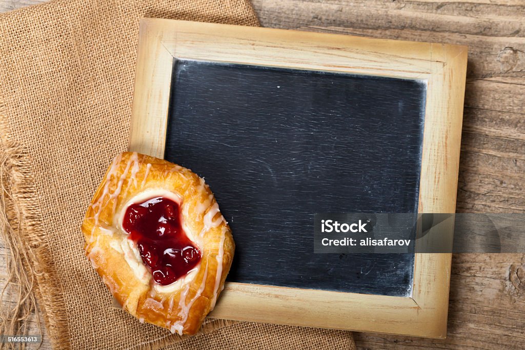 Cherry pastry Delicious Cherry pastry and custard with chalkboard. Selective focus. Baked Stock Photo