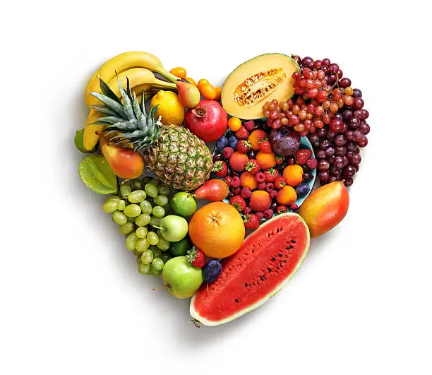 Photo of Heart symbol. Fruits diet concept.