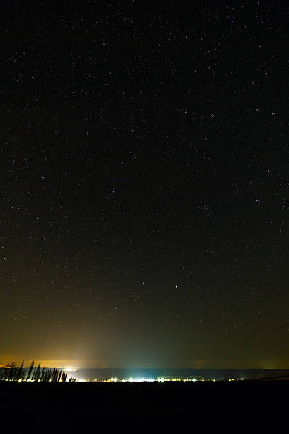 istock Starry sky above the illuminated city. 516554618