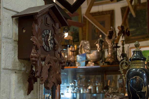 an old wall clock stands out in an antique shop