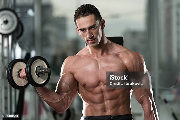 Young Man Doing Exercise For Biceps Stock Photo - Download Image Now - Abdominal Muscle, Active Lifestyle, Adult