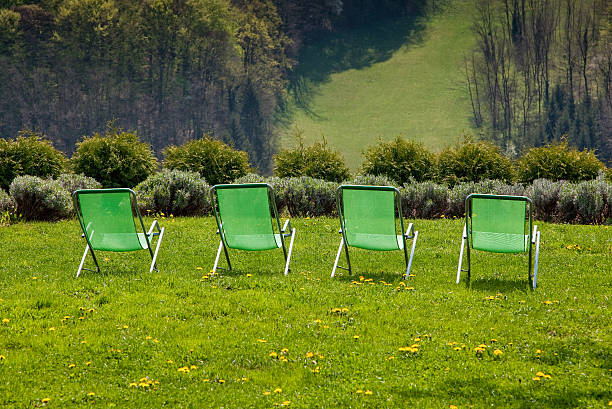 Free Stock Photo of Row of Lawn Chairs on Lush Green Field | Download ...