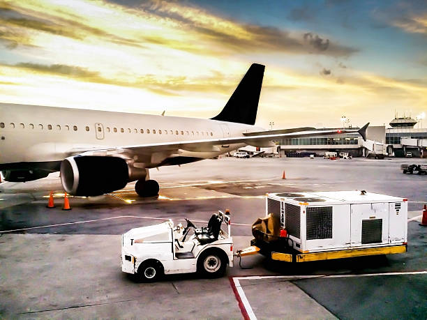 istock Luggage Car Near Airplane 516589445