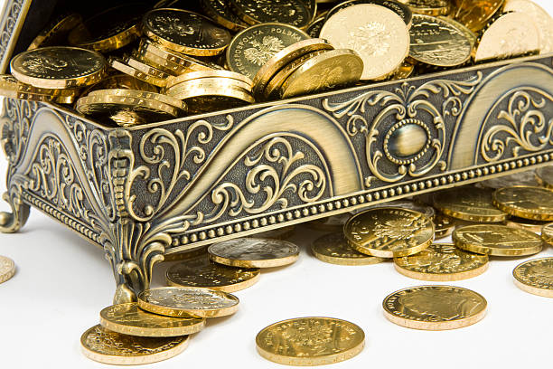 istock gold casket and gold coins on a white background 516590225