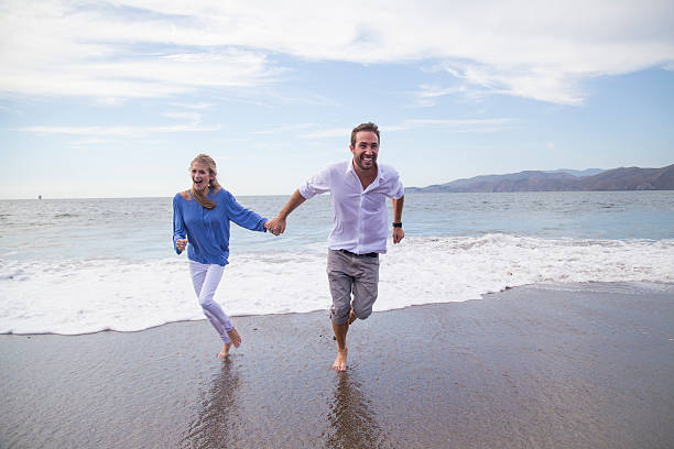 istock Young couple having fun at the beach 516592493