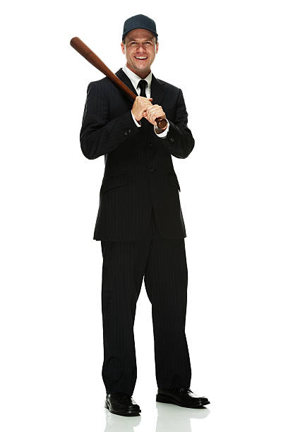 istock Smiling businessman holding baseball bat 516593505