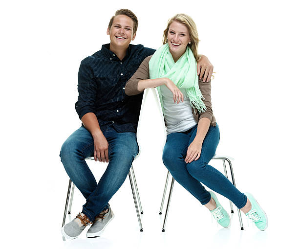 istock Cheerful couple sitting on chair 516593513