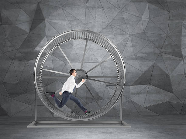 istock Businessman in spinning wheel 516595166