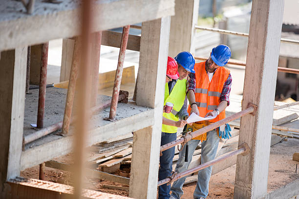 istock Architects looking at blue print outdoor 516597770