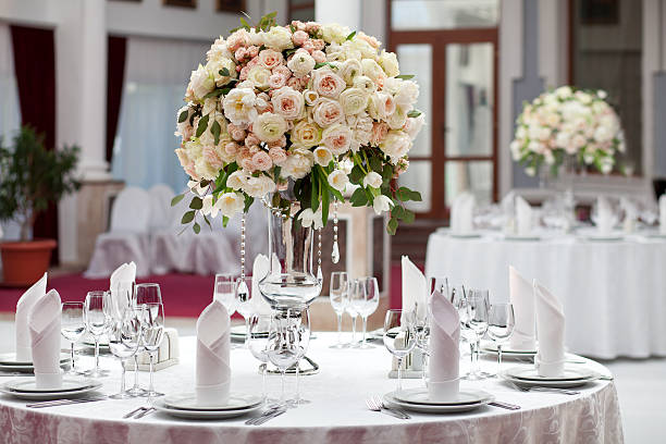 beautiful flowers on table in wedding day. luxury holiday background - pronkstuk stockfoto's en -beelden
