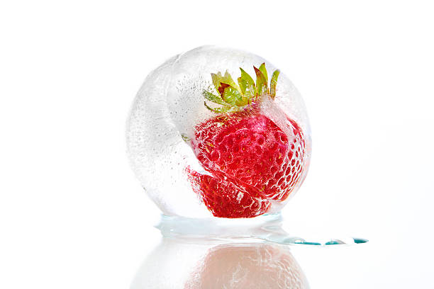 istock Strawberry frozen inside an ice ball 516601982