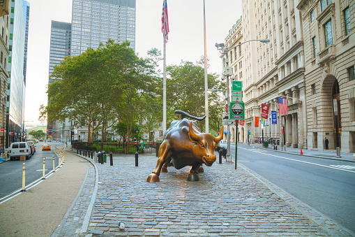 New York, USA - September 5, 2015: Charging Bull sculpture. The sculpture is both a popular tourist destination, as well as \