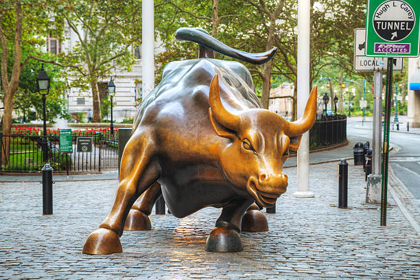 New York, USA - September 5, 2015: Charging Bull sculpture. The sculpture is both a popular tourist destination, as well as \