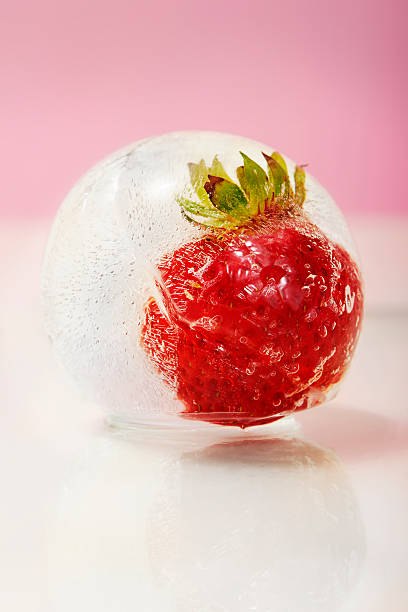 istock Strawberry frozen inside an ice ball 516602582
