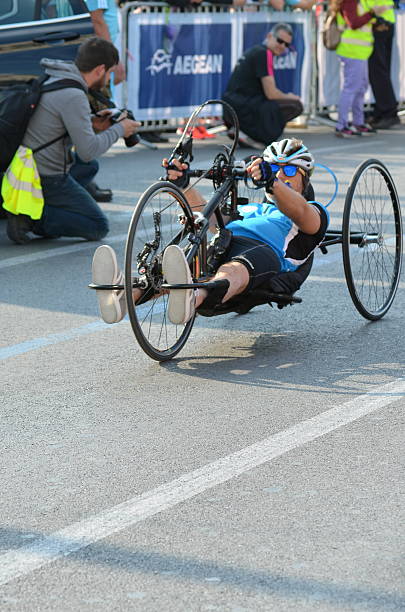 ATHENS Half Marathon Running Event 2016 Athens, Greece - March 20, 2016: handicapped Athlete during the half marathon event in the center of Athens paralympic games stock pictures, royalty-free photos & images