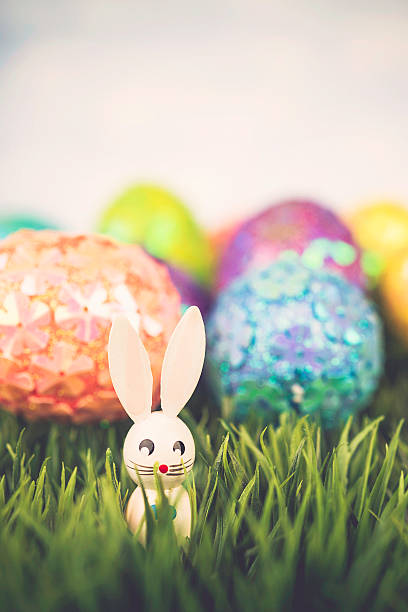 istock Easter background with glitter eggs and vintage Easter bunnies 516606388