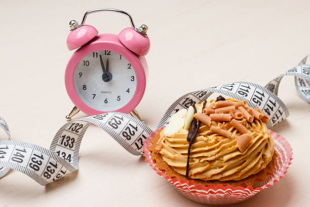 istock Sweet food measuring tape and clock on table 516606732