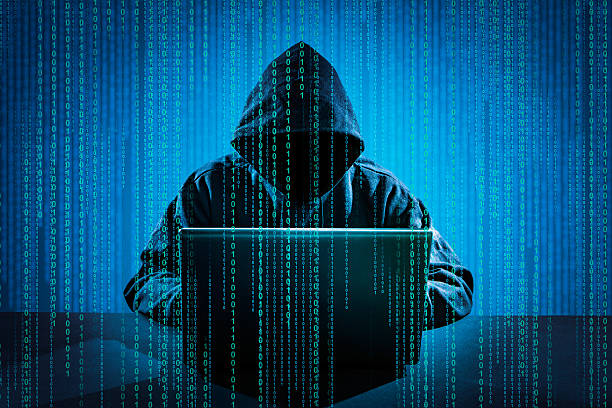 Computer crime concept. Hacker using laptop. Hacking the Internet. computer hacker stock pictures, royalty-free photos & images