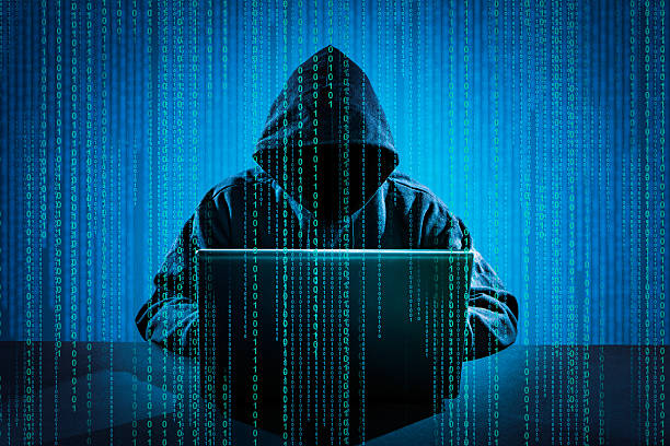 Computer crime concept. Hacker using laptop. Hacking the Internet. computer hacker security computer stealing stock pictures, royalty-free photos & images