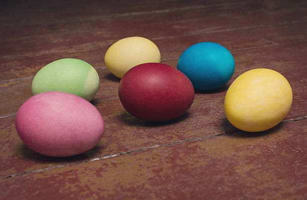 istock Easter eggs on a old wooden background 516608394