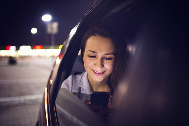 istock Woman using smartphone in the car 516609208