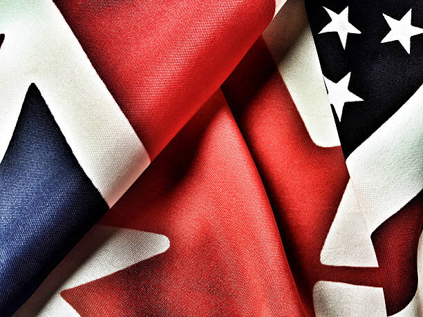 istock British, Canadian and American flags 516609290