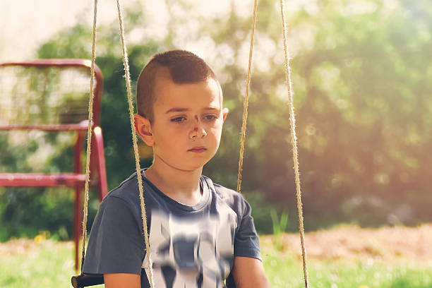 istock Sad boy with Mohawk haircut and a nose bruise 516609534
