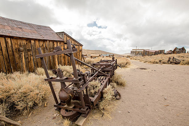 istock old machines at front of old house on cloudy day 516614503