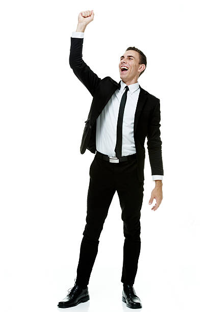 istock Cheerful businessman cheering with hands raised 516615397