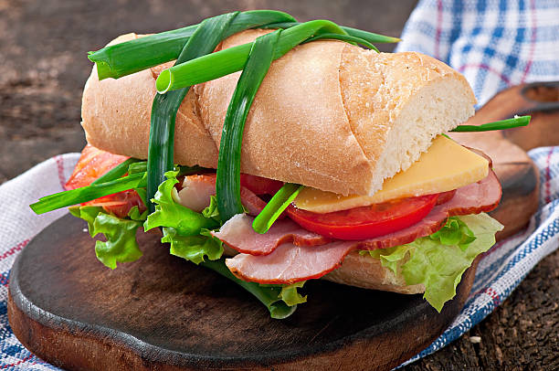 istock Sandwich with ham, cheese and fresh vegetables 516615651