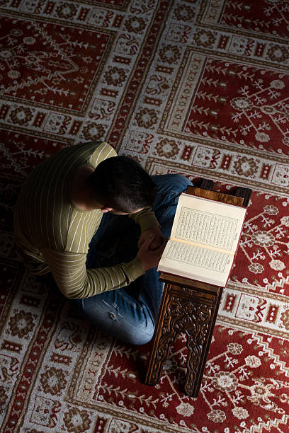 istock Muslim Man Is Reading The Koran 516616417