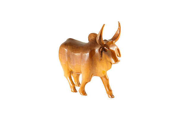 istock wood cow on white background 516617363